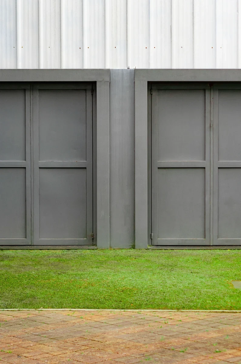 Close view of grey garage door panels and architectural detailing